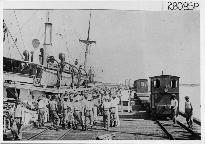 Image of crews arriving and leaving from a jetty. 